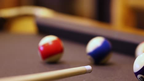 Playing-Billiards---Hitting-Balls-With-Cue-Stick---close-up