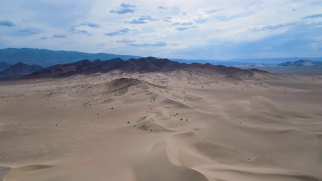 Aerial-footage-Mojave-Desert-Southern-California-Dumont-Dunes-with-mountains-in-distance