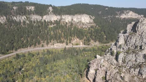 Drone-flying-by-canyon-edge-in-Spearfish-Canyon-in-the-fall