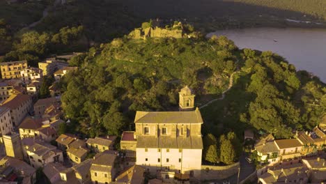 Aerial-Pullback-Reveals-Historic-Center-of-Trevignano-with-Fortress-in-Background