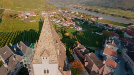 Close-proximity-fpv-shot-flying-around-the-abbey-of-Spitz-in-wachau-valley-during-a-beautiful-painterly-autumn-sunset