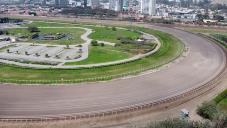 Drone-video-orbiting-around-the-turn-of-a-horse-racetrack