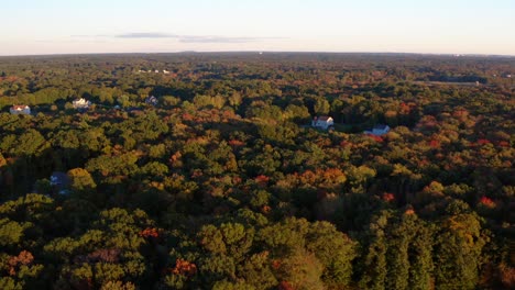 Aerial-view-beautiful-color-changing-trees-countryside-Rehoboth,-Massachusetts