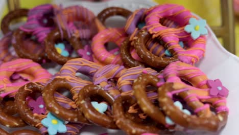 Pan-of-pretzels-on-the-table-with-icing-and-sprinkles