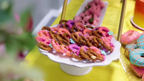 Pan-of-pretzels-on-the-table-with-icing-and-sprinkles