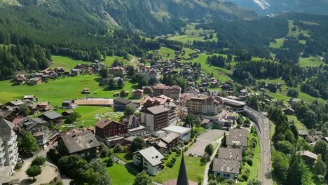 Aerial-reveal-and-approach-over-Wengen,-Switzerland