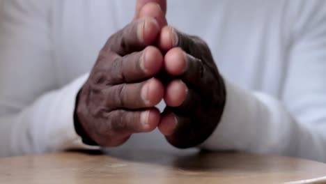 man-praying-to-god-with-hands-together-Caribbean-man-praying-with-white-background-stock-footage