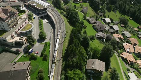 Overhead-aerial-view-of-the-train-in-Wengen,-Switzerland-1-of-3