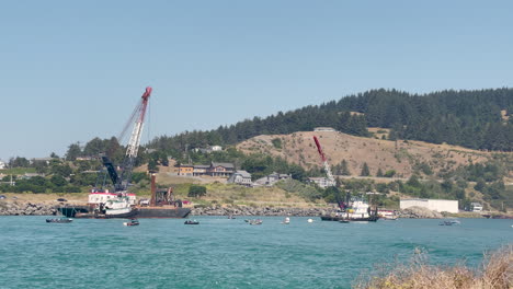 Dredging-ships-on-the-Rogue-River-in-Gold-Beach,-Oregon