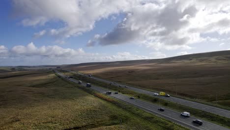 Aerial-transport-footage-of-the-M62-Motorway-at-its-Summit,-the-highest-motorway-in-England