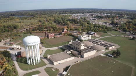 Flint,-Michigan-water-treatment-plant-and-water-tower-with-drone-video-moving-at-an-angle-sideways