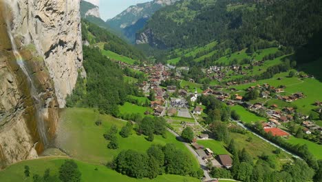 Aerial-view-of-the-base-of-Staubbach-waterfall-and-a-rainbow-in-Lauterbrunnen,-Switzerland