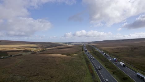 Aerial-video-footage-of-the-M62-Motorway-at-its-Summit,-the-highest-motorway-in-England