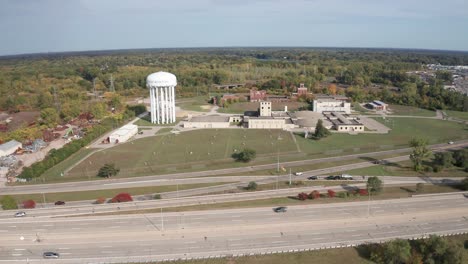 Flint,-Michigan-water-tower-and-treatment-plant-wide-shot-drone-video-moving-forward