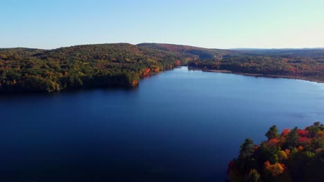 A-panning-shot-high-up-over-a-lake-in-Maine-during-the-Fall