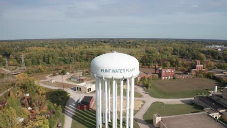 Flint,-Michigan-water-tower-with-drone-video-close-up-and-pulling-out