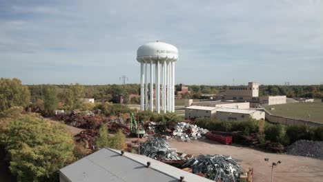 Flint,-Michigan-water-tower-with-drone-video-moving-from-ground-up