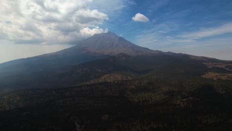 Aerial-view-away-from-the-Popocatepetl-Active-Volcano-in-Mexico---pull-back,-drone-shot