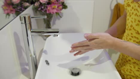 A-woman-washing-her-hands,-close-up