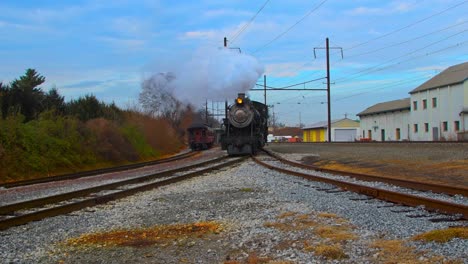 A-Steam-Engine-Moving-Along-a-Curve-with-a-Passenger-Train-Just-Passed