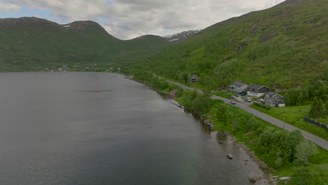 Scenic-Coastal-Road-With-Car-Driving-On-Kvaloya-Fjord,-Northern-Norway