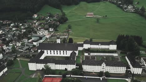 Drone-aerial-over-large-courtyard-and-showing-the-whole-town-of-Endelberg-in-Switzerland