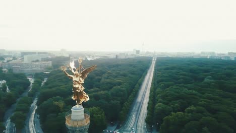 Drone-aerial-parallax-over-Berlin-Victory-Column-during-sunrise-near-Berlin-city
