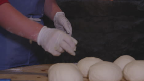 Female-Hands-Kneading-Dough,-Preparation-For-Khinkali-Georgian-Dumplings---close-up