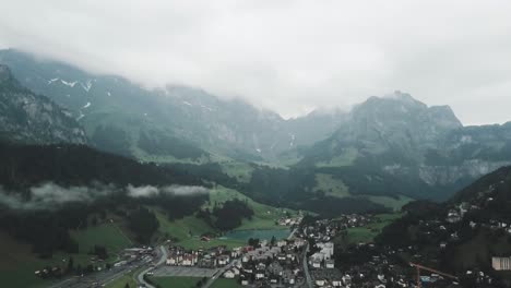 Drone-aerial-slow-pan-left-over-Endelberg-in-Switzerland-on-a-cloudy-day-showing-the-mountains