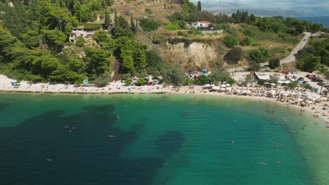 Aerial-view-of-swimmers-in-Kasjuni-bay-and-beach-in-Split,-Croatia