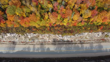 Top-view-from-drone-of-mountain-road-in-woods