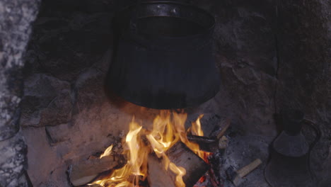 Vintage-Steel-Pot-Over-Wooden-Oven-Stove