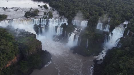 Giant-Iguazu-Falls-with-crashing-water-surrounded-by-nature-in-south-america