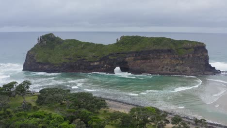 Drone-of-Hole-in-the-Wall-Transeki-Wild-coast-and-waves-crashing-on-green-rocky-hills