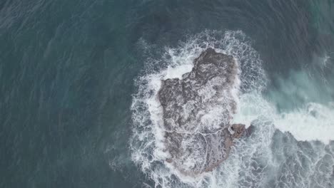 waves-crashing-onto-a-rock-from-above