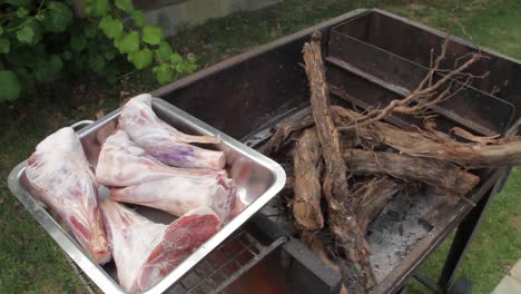 Preparing-to-cook-on-a-fire-in-a-pot-with-lamb-shanks