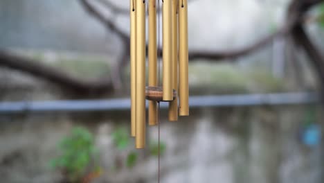 Wind-Chimes-As-Garden-Ornament-Slowly-Moving-With-The-Wind