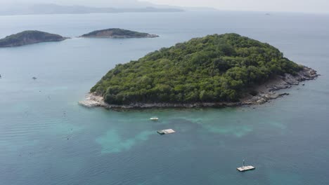 Drone-flying-over-uninhabited-island-in-Ksamil-Albanian-riviera-on-mediterranean-sea