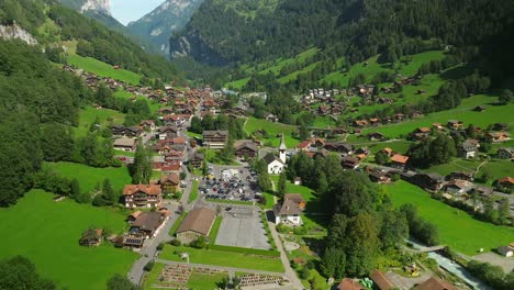 Descending-aerial-approach-of-Lauterbrunnen,-Switzerland