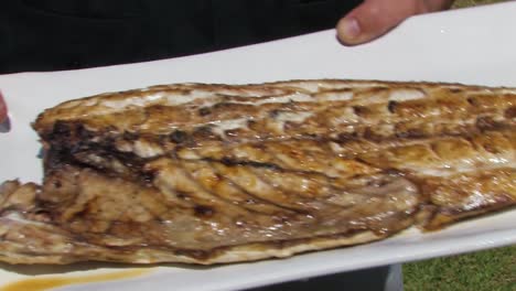 Freshly-served-grilled-fish-on-platter