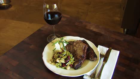 Lamb-chops-being-served-with-salad