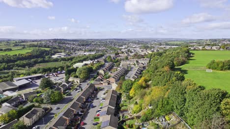 Aerial-drone-footage-a-scenic-View-Of-Houses-And-Green-Trees-At-The-Residential-Terraced-Housing-In-the-United-Kingdom---aerial-shot