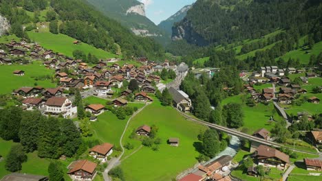 Aerial-approach-of-the-train-station-in-Lauterbrunnen,-Switzerland