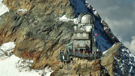 Aerial-view-of-the-sphinx-observation-deck-and-observatory-at-the-Jungfraujoch,-Switzerland