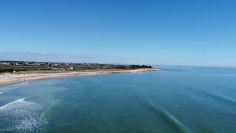 View-over-the-island-of-Ré-at-Sainte-Marie-De-Ré,-drone-shot-in-sun-with-blue-sky