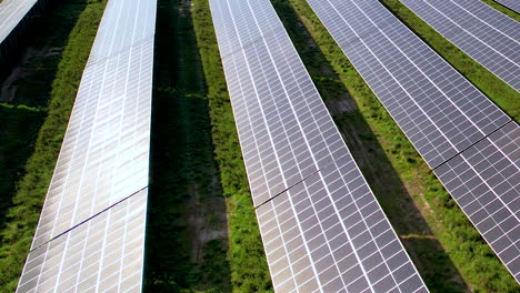 Drone-Shot-Of-Solar-Power-Station-Panels-On-Green-Field
