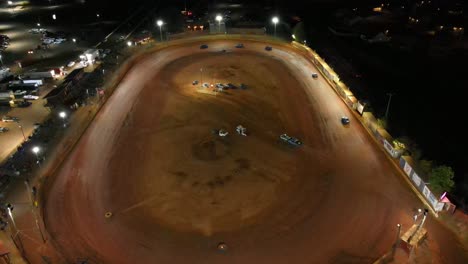 slight-aerial-orbit-of-oval-dirt-track-racing-during-a-race-at-night
