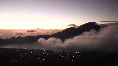TIMELAPSE:-Clouds-rolling-in-through-valley-and-blocking-view-of-mountain-at-sunrise