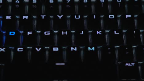Backlit-illuminated-keyboard-in-white-with-the-wasd-keys-in-blue-contrast-for-a-perfect-gaming-experience-with-a-breathing-pattern