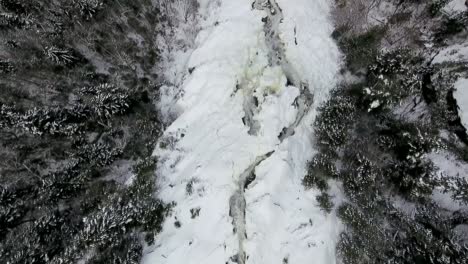 A-big-frozen-waterfall-filmed-in-Quebec,-Canada